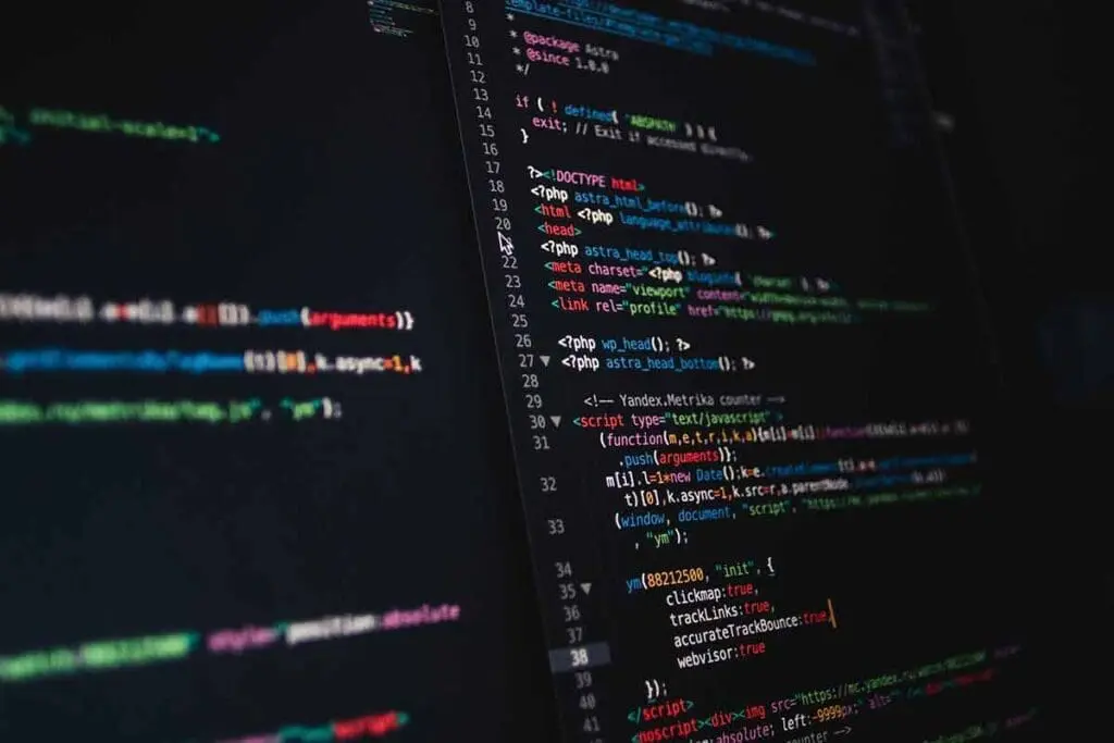 A computer monitor with code showing on it