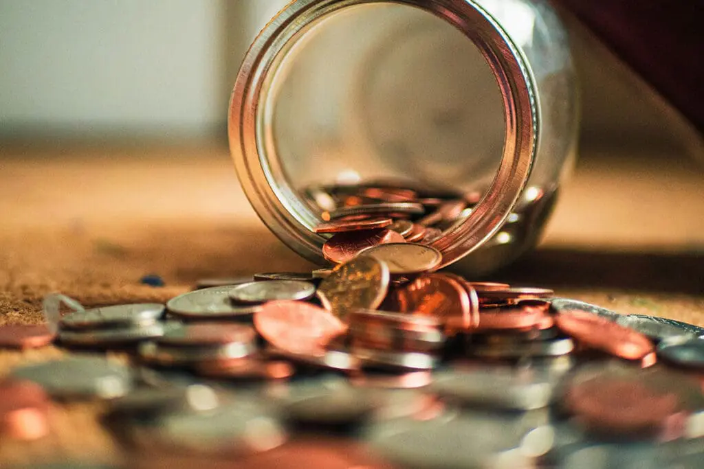 A jar of coins lying on its side